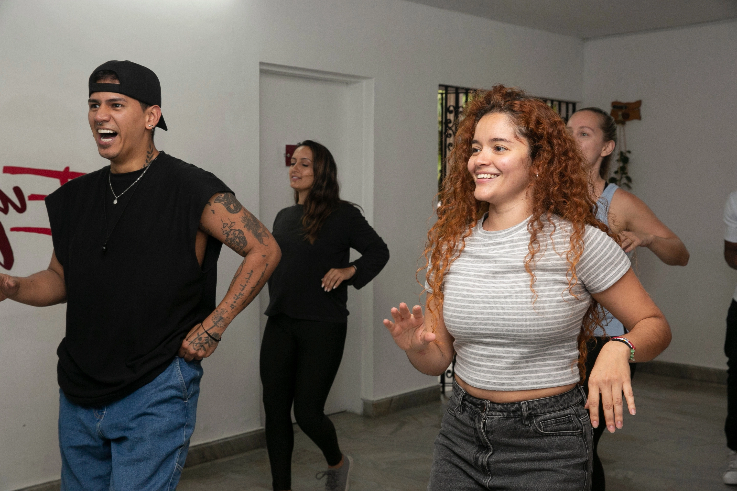 Students enjoying salsa classes in Medellín, learning dance steps in a fun and immersive environment.
