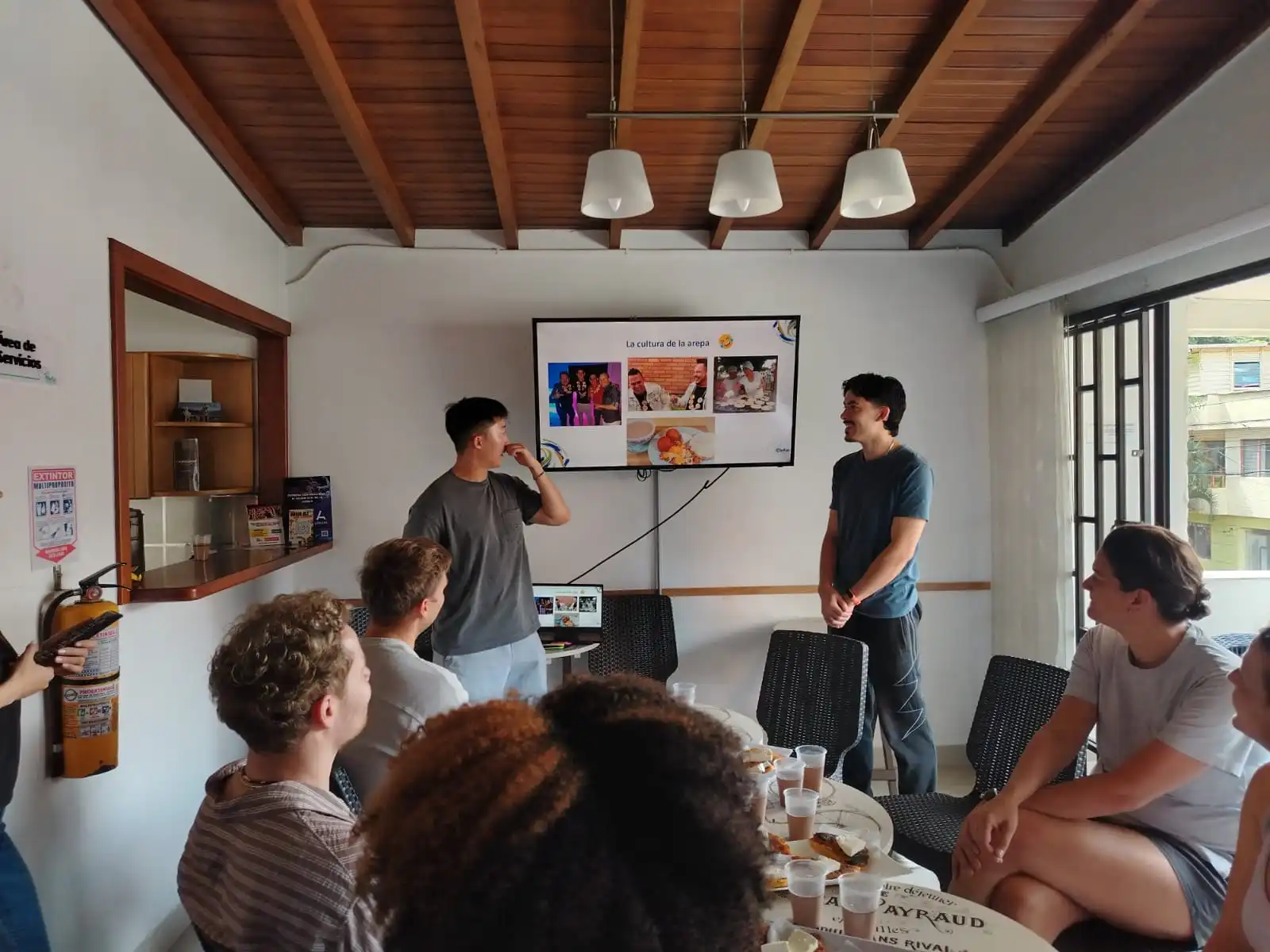Students participating in an interactive Spanish class in Medellín, Colombia, as part of an immersion Spanish course focused on learning Colombian Spanish."